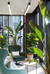 Corner office sitting area with large bird of paradise and fiddle leaf fig plants.